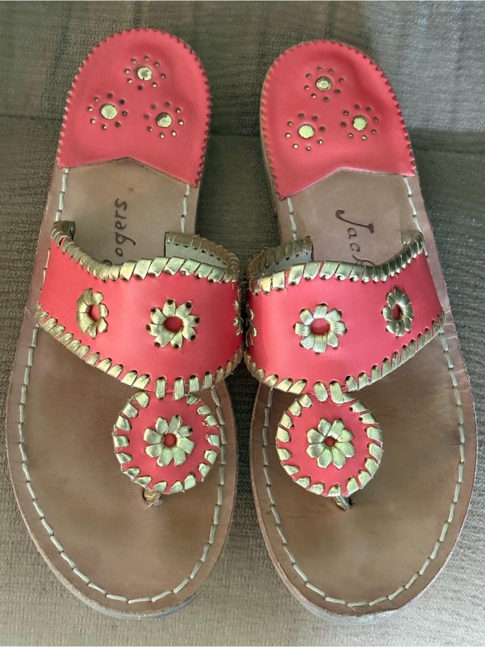 Coral pink with gold Jack
Rogers. Size 7m